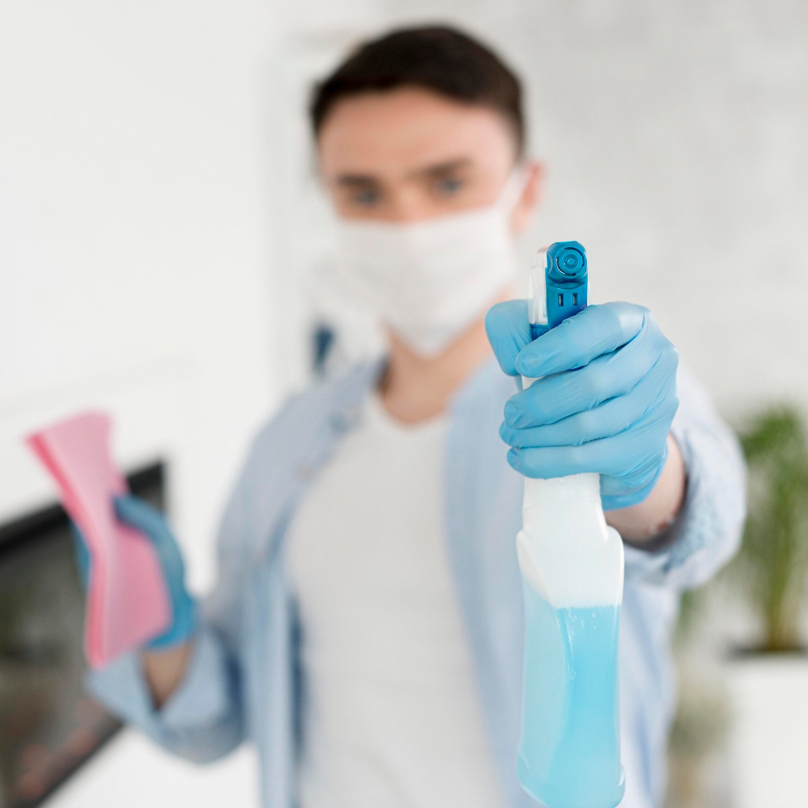 defocused man with face mask holding ablution